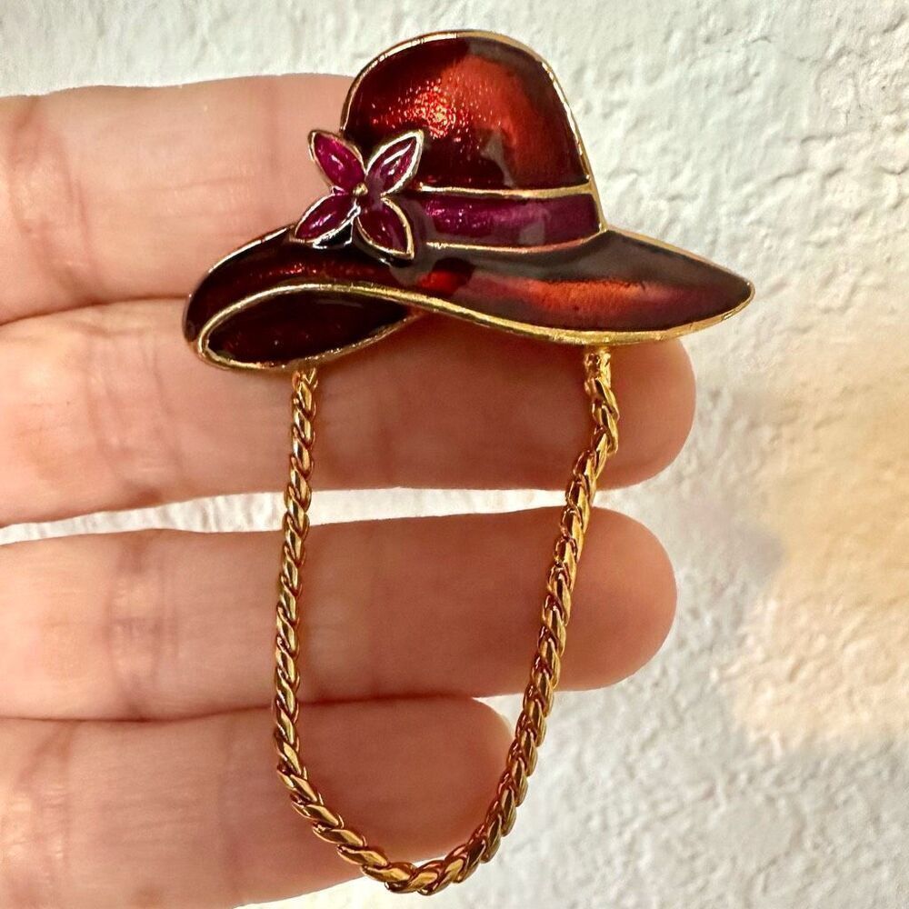 Red enamel hat brooch with gold tone chain